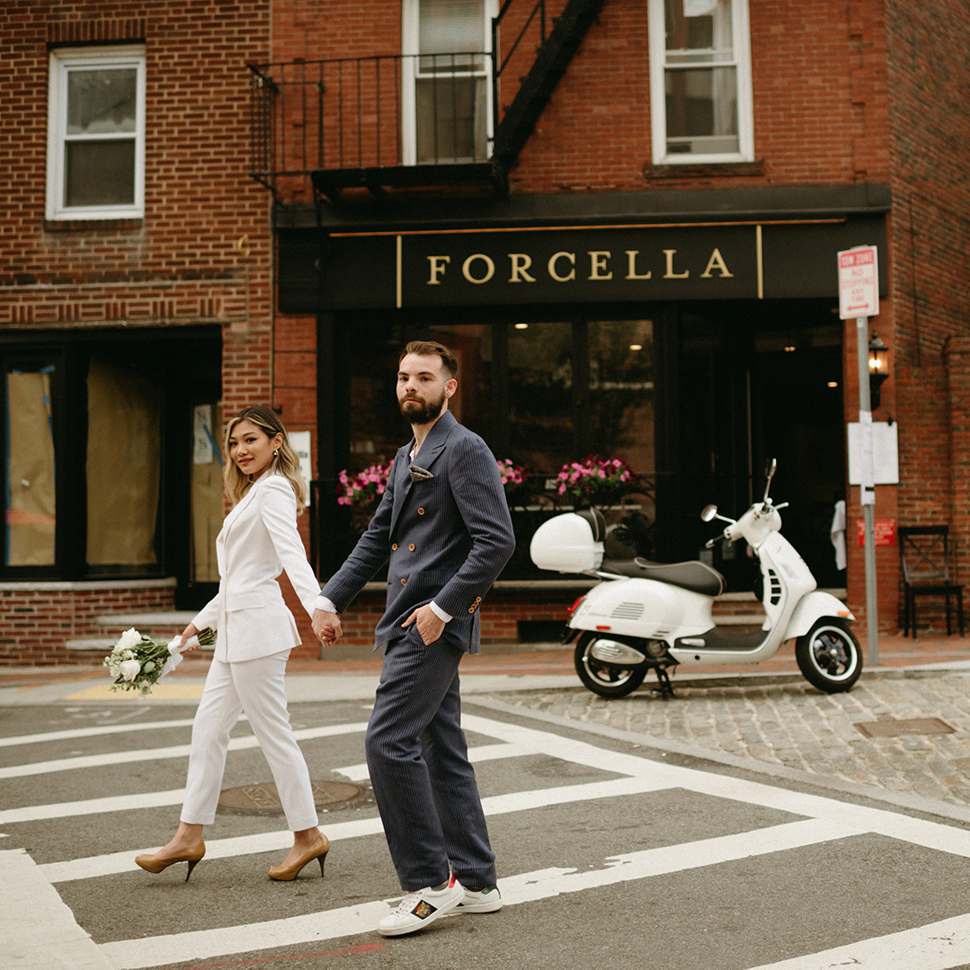 A couple crossing the street in Boston's North End